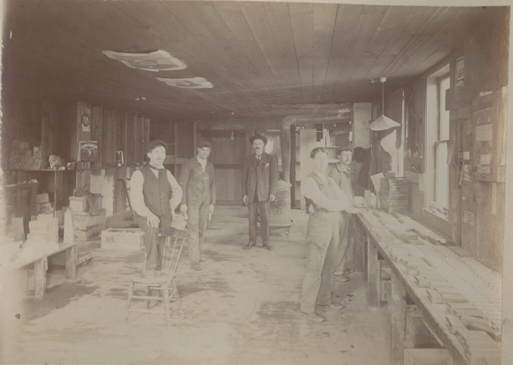 Employees of Deerlick Oil Stone Co. in Finishing Area of River Street Factory
