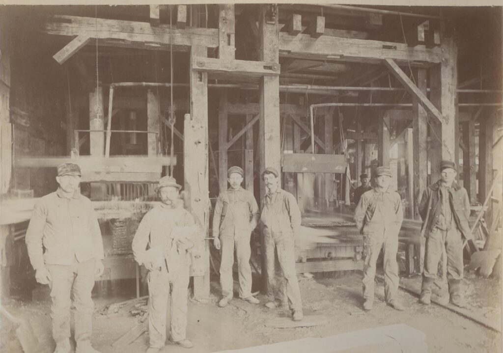 Employees of Deerlick Oil Stone Co. in Cutting Area of River Street Factory